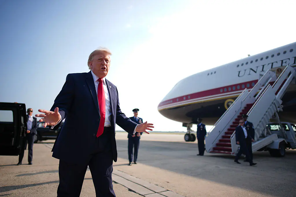 Trump is clearly very happy with his present. Credit: Andrew Harnik/Getty