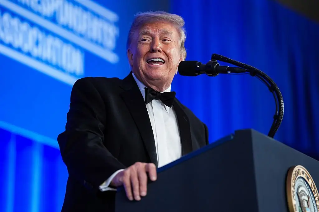 President Donald Trump addressed reporters and other guests Friday at the rescheduled White House Correspondents' Association Dinner. Credit: Eric Lee / Getty