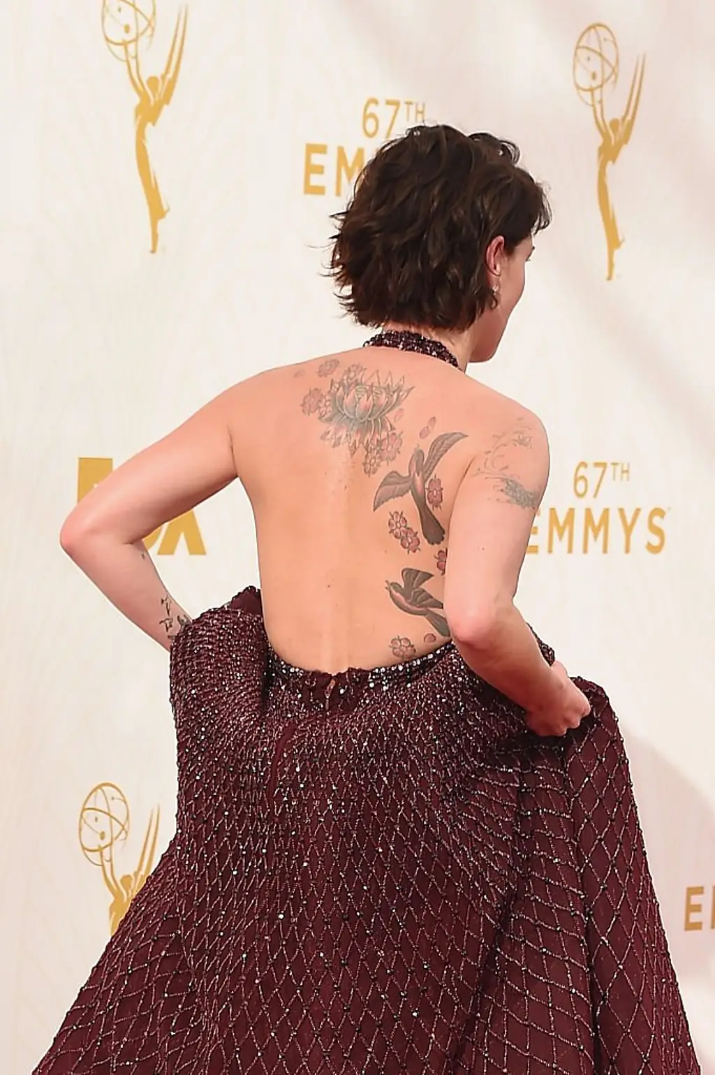 The actress revealed she got her entire back tattooed as a tactic to discourage excessive on‑screen nudity. Credit: Steve Granitz / Getty