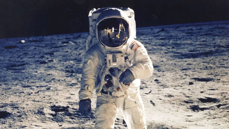 Digital artist enhanced reflection of Buzz Aldrin's helmet from moon landing and it highlights one key detail