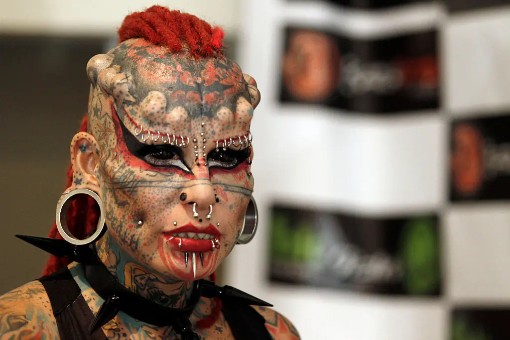 Woman who covered entire body in tattoos to become a 'vampire' issues warning to others