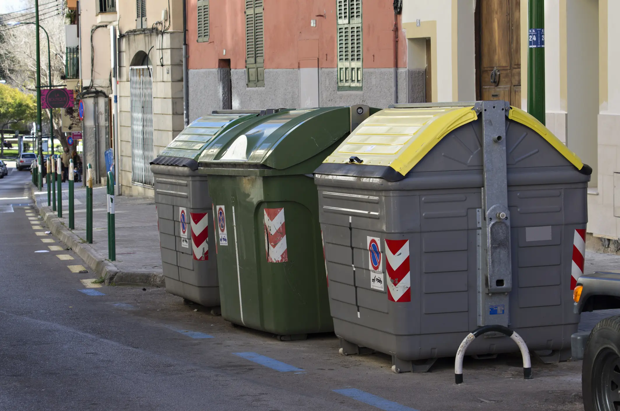 Trash containers on a street in Palma. Credit: Driendl Group / Getty (Stock photo)