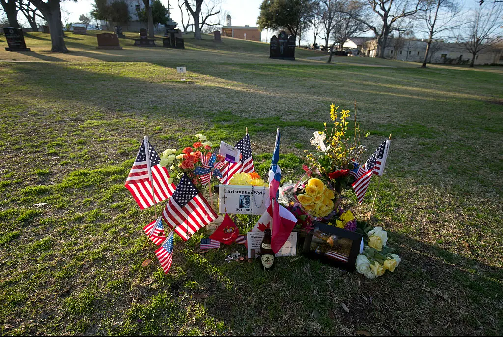 Memorabilia adorns the Texas State Cemetery grave of U.S. Navy Seal sniper Chris Kyle near the Texas State Capitol. Credit: Robert Daemmrich Photography Inc / Getty
