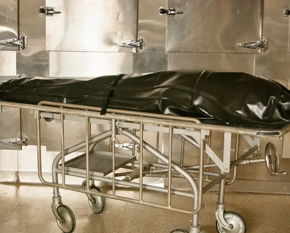 The man was declared dead and zipped into a body bag. Credit: Insight Imaging / Getty