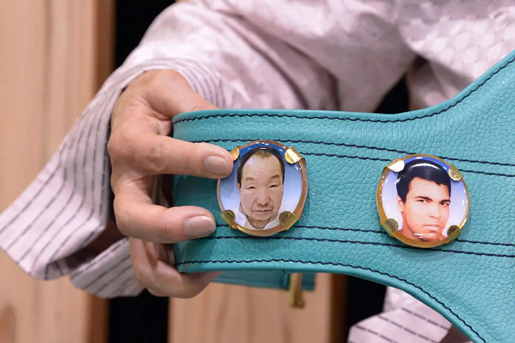 Iwao's sister, Hideko Hakamada, holds the WBC honor championship belt for her brother, who is the longest-serving death row prisoner. Credit: NurPhoto / Getty