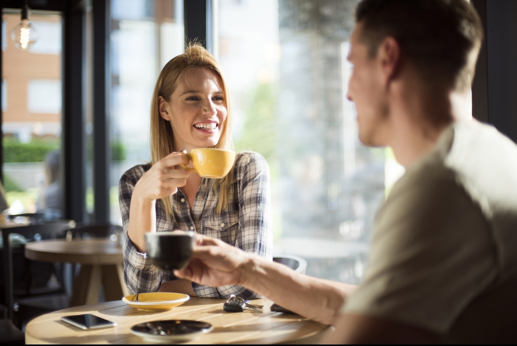 A man and a woman on a coffee date.