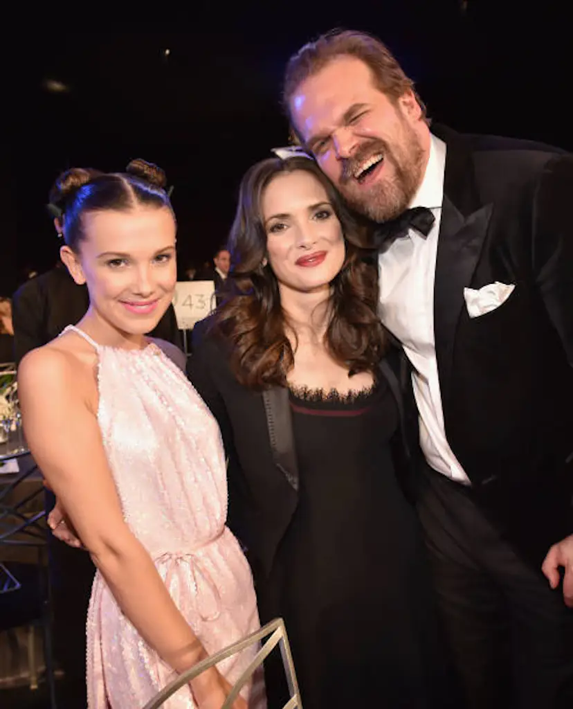Millie Bobby Brown, Winona Ryder, and David Harbour pictured in 2017. Credit: Kevin Mazur / Getty Images.