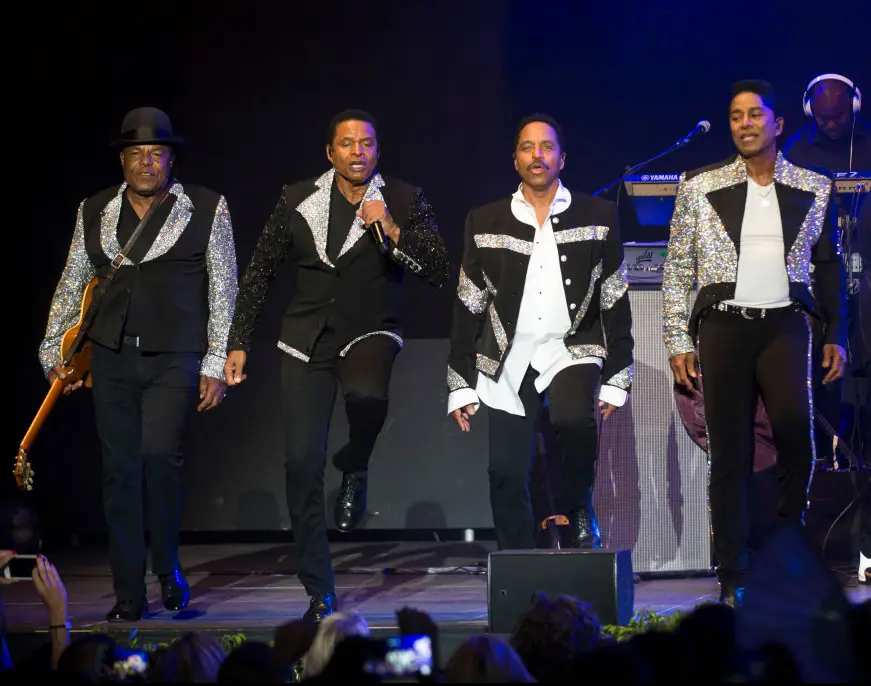 The Jacksons - Tito recognizable by his iconic bowler hat - performing after Michael's death in 2018. Credit: Jordi Vidal / Getty