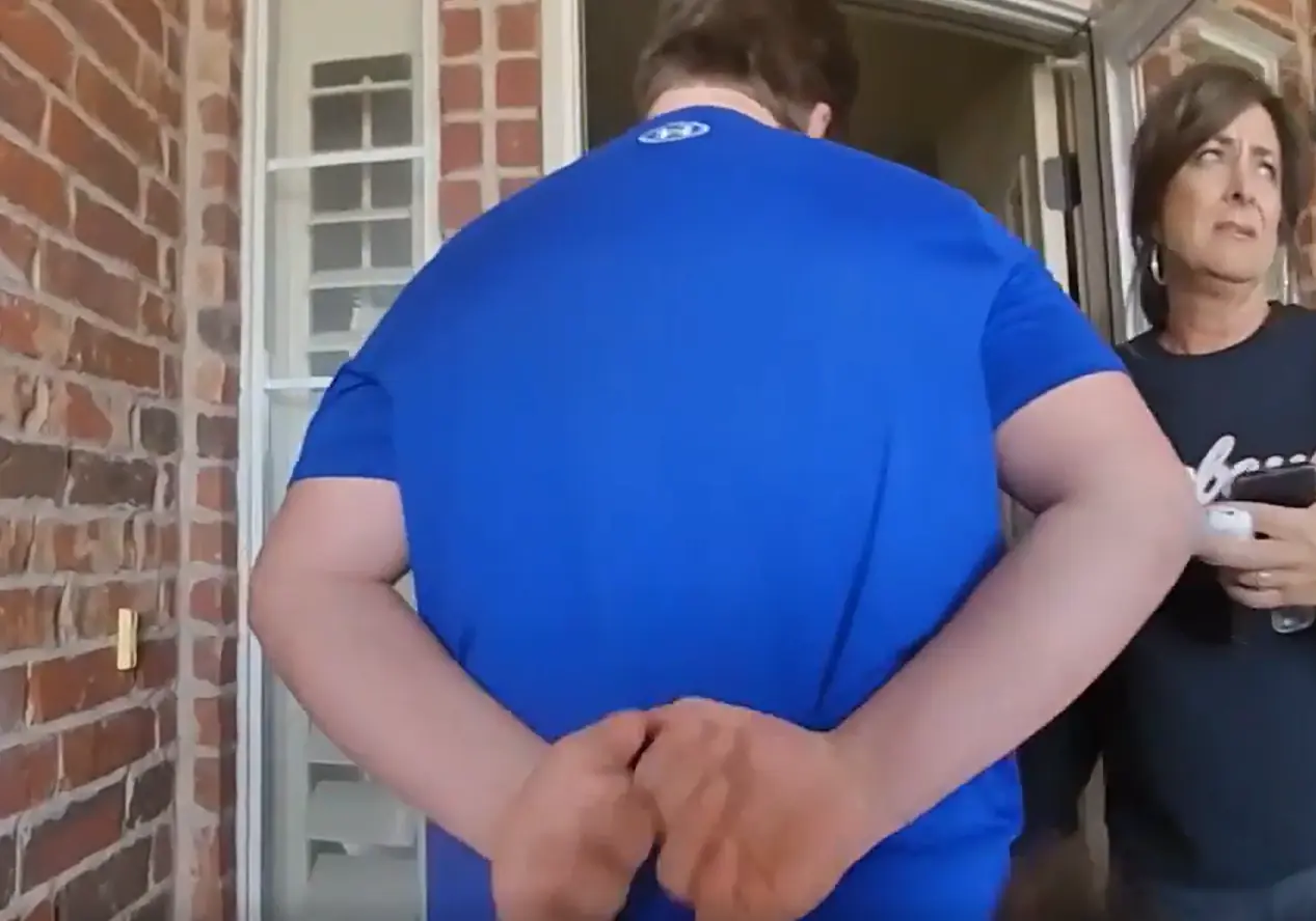 Jesse Butler was handcuffed outside his house. Credit: Stillwater Police Department