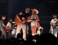 'Hawk Tuah Girl' is invited up on stage by country singer Zach Bryan and sends crowd wild