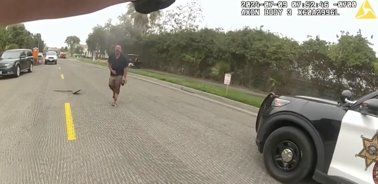Disturbing bodycam footage shows man accused of decapitating his parents and killing their dog singing Tina Turner songs after being shot