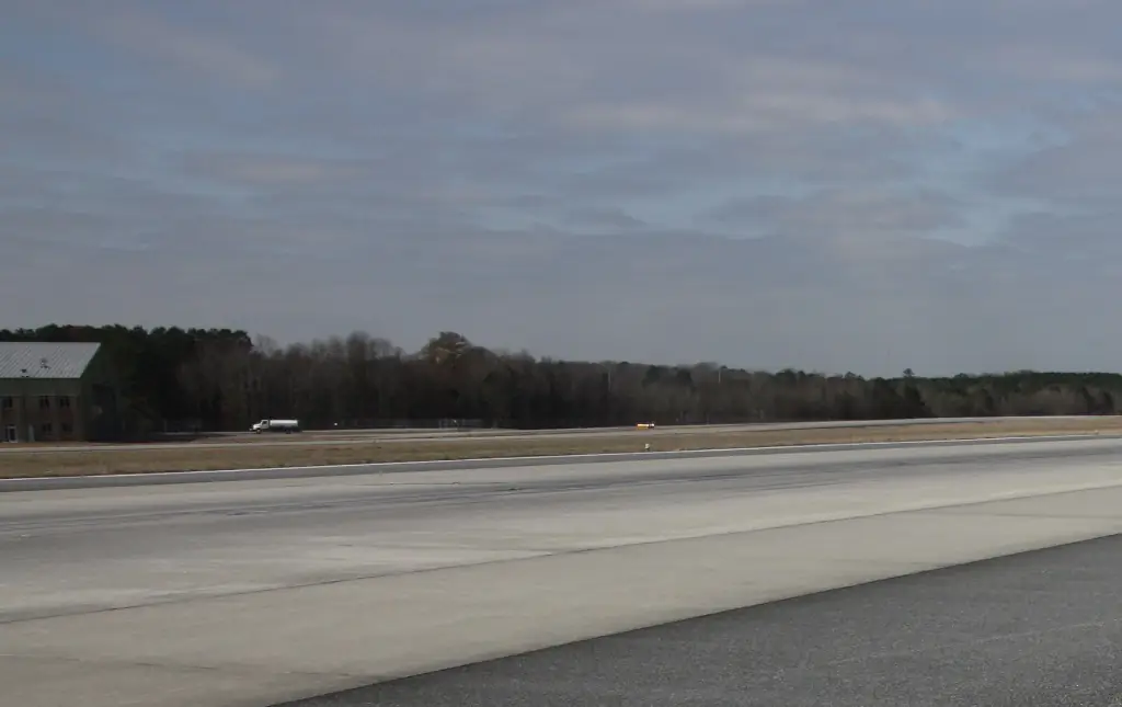 Reason why two people are buried in graves under an airport's busy runway