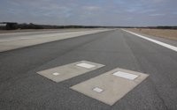 Reason why two people are buried in graves under airport's busy runway