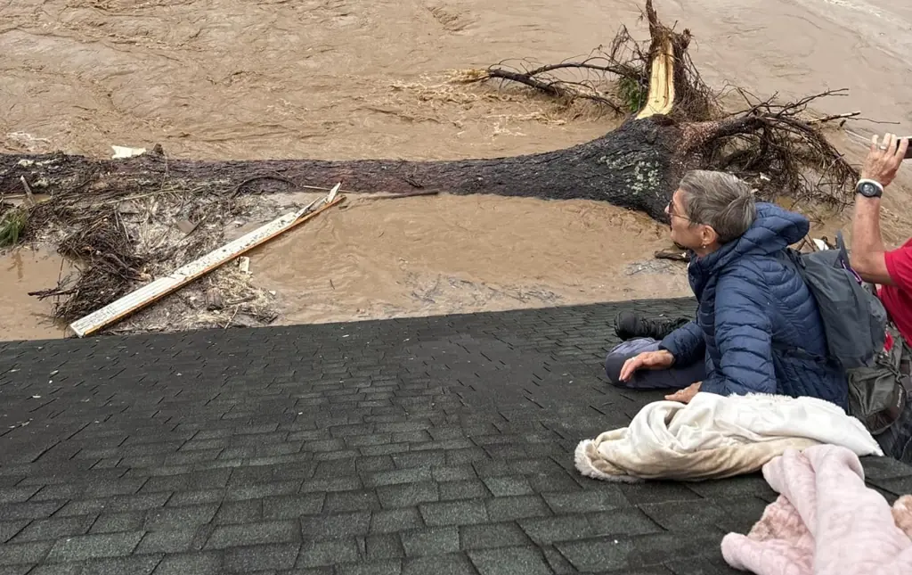 Family pays tribute to grandparents and grandson, 7, after they were swept away by floods after taking shelter on roof