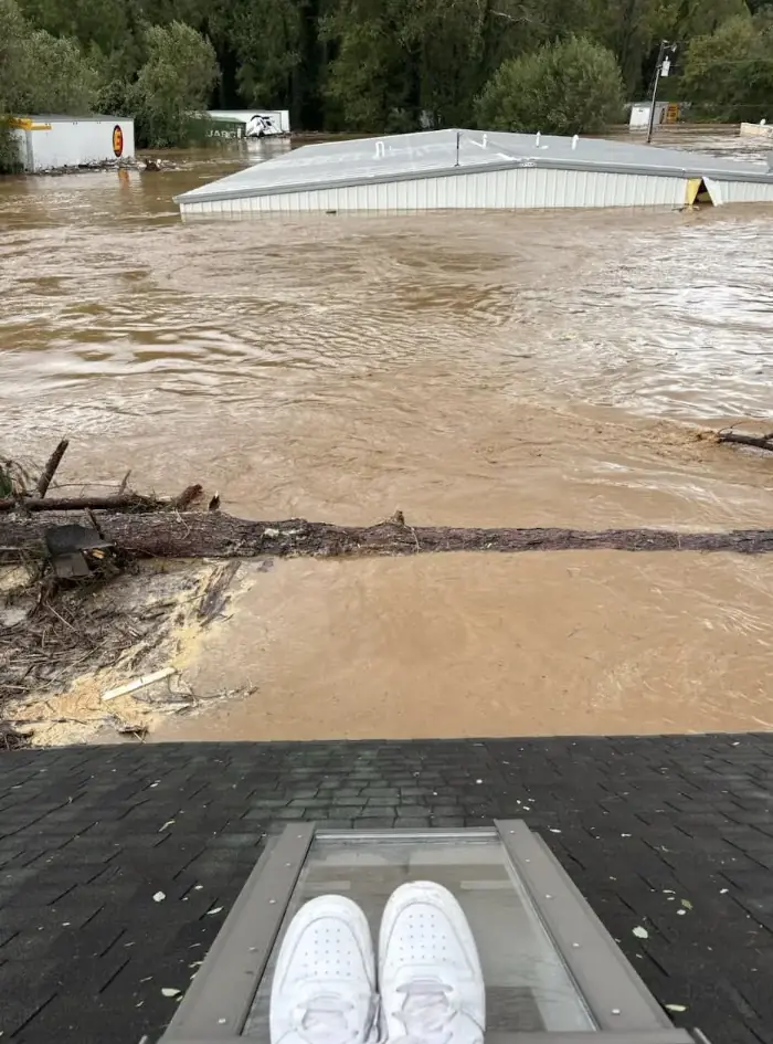 Megan on the roof before the house collapsed. Credit: Jessica Drye Turner/Facebook