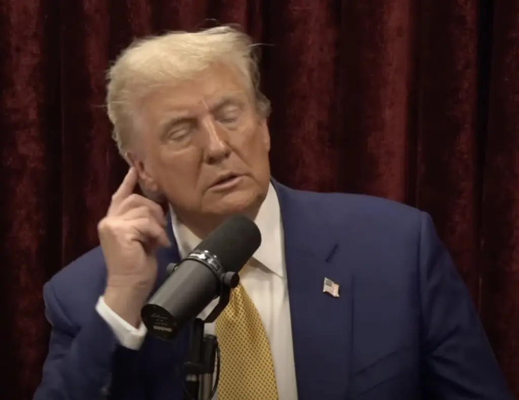 Trump shows Rogan his injury. Credit: YouTube/PowerfulJRE