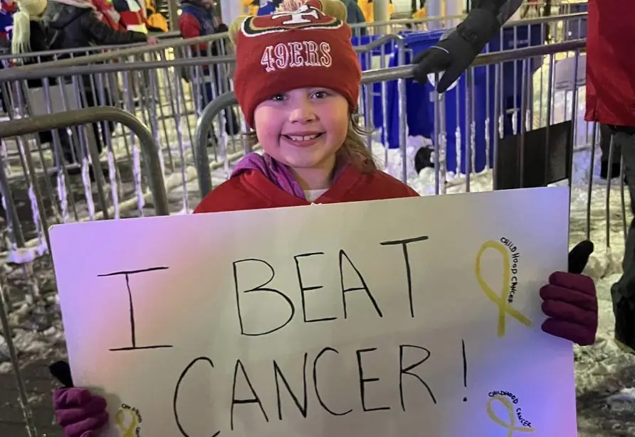 Drunk fans push girl, 8, holding 'I beat cancer' sign down stairs at her first NFL game, mom claims