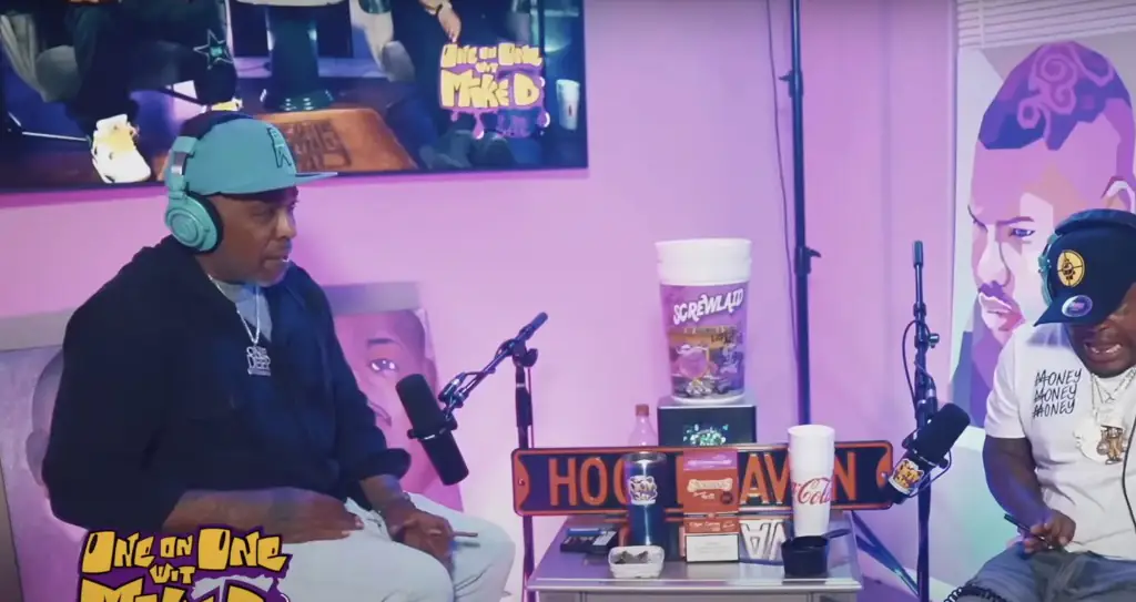 Moment Texas rapper accidentally fires gun through his jeans during interview