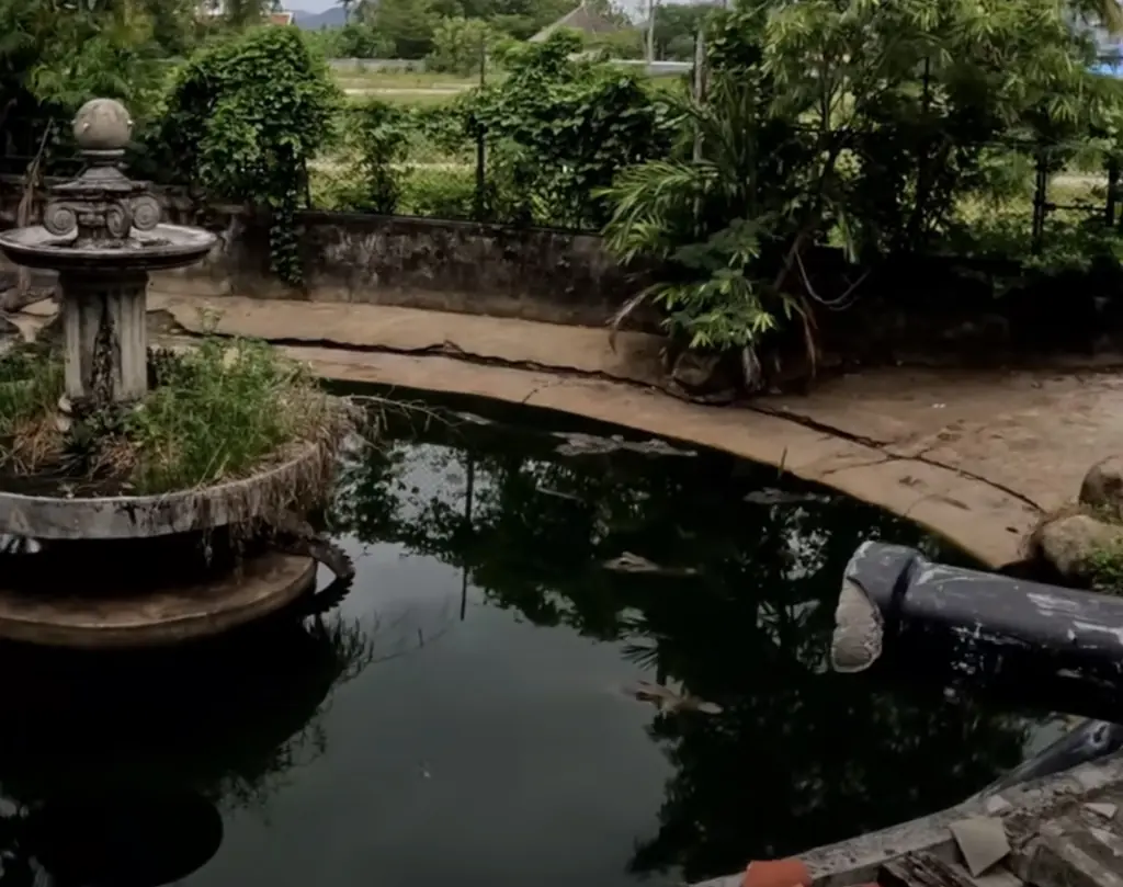 Man exploring abandoned zoo is stunned at what happens after throwing something into a pond