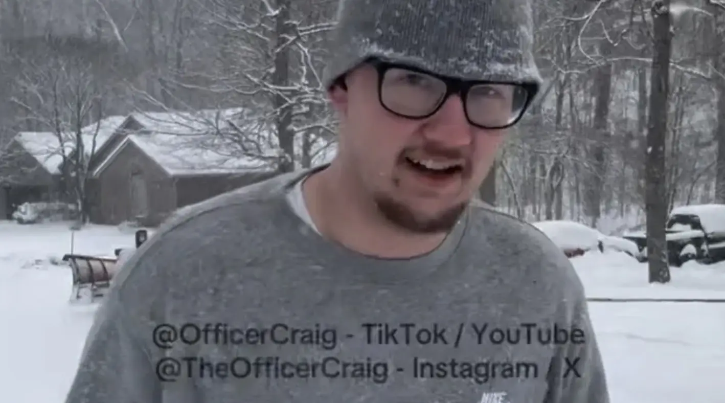 Police officer's heartwarming act for pizza delivery driver who only got $2 tip despite walking half a mile in snow storm wearing just a sweater
