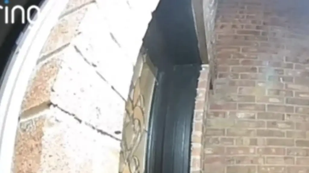 Terrifying moment 'devil' figure approaches Texas household holding chilling sign