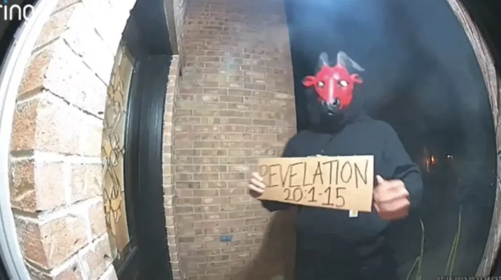 Terrifying moment 'devil' figure approaches Texas household holding chilling sign