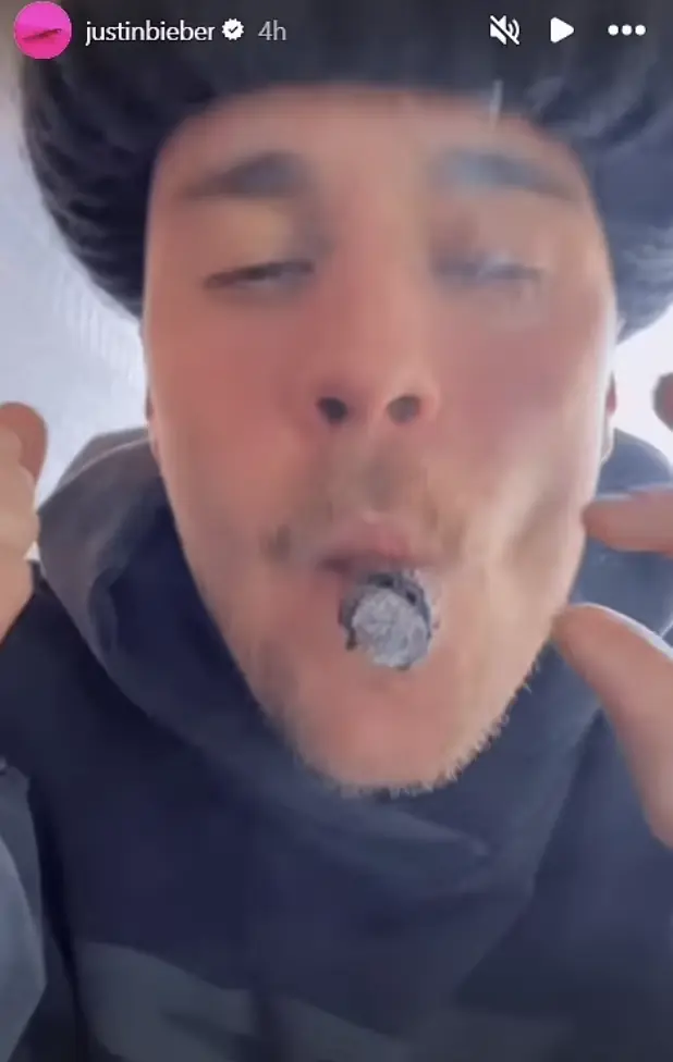 Justin Bieber sparked concern among fans after a video surfaced showing the pop star smoking and rapping in a manner that some have described as "bizarre." Credit: Instagram