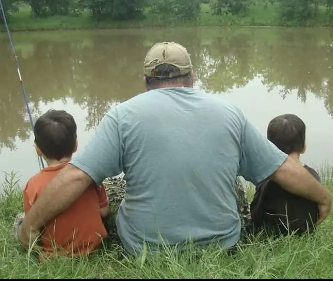 An old family photo of Metcalf with his dad and brother. Credit: GoFundMe