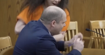 Wisconsin killer who dismembered her boyfriend attacks her own lawyer in court
