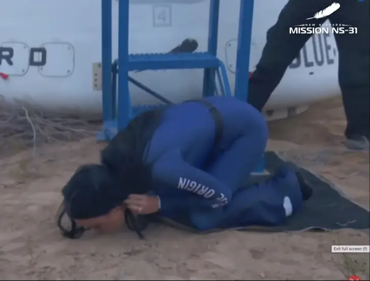 Katy kissed the ground after touching down. Credit: YouTube/Blue Origin