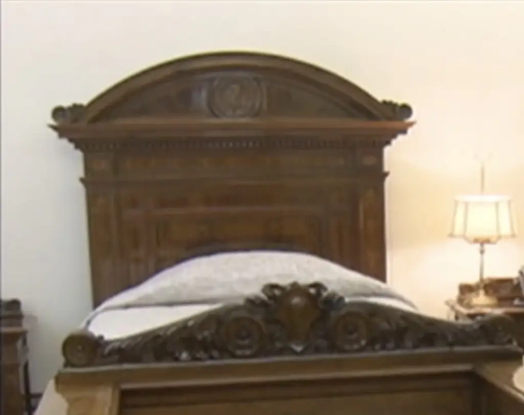 The Pope's bedroom had just a simple wooden single bed. Credit: CNN/Vatican TV