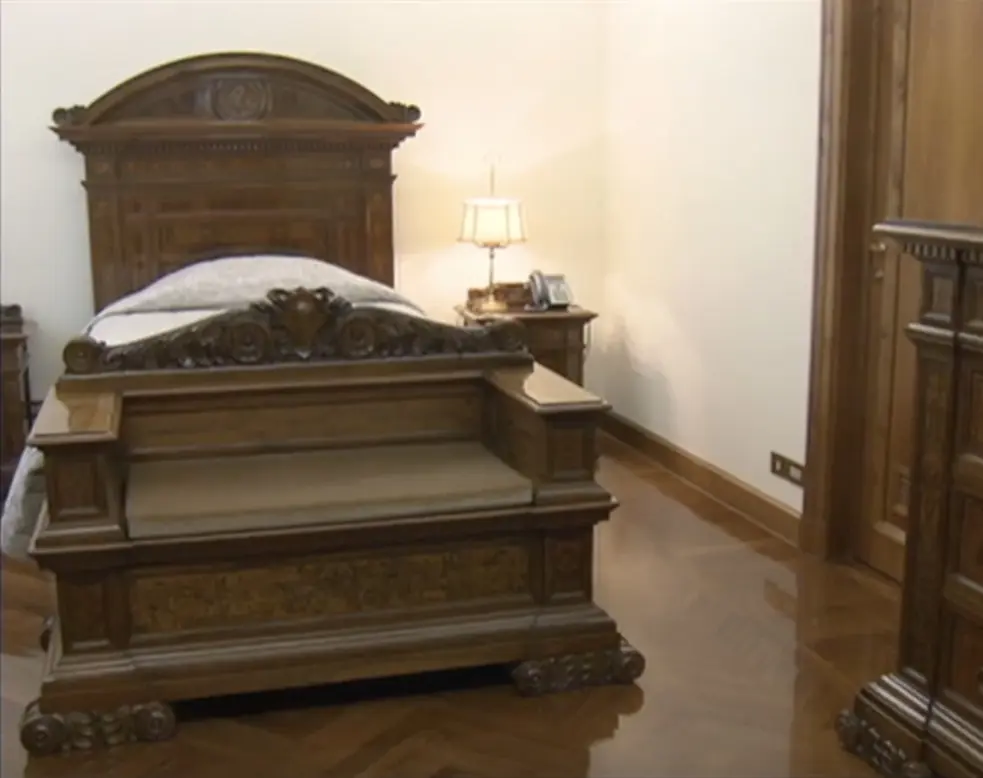The Pope's bedroom had just a simple wooden single bed. Credit: CNN/Vatican TV