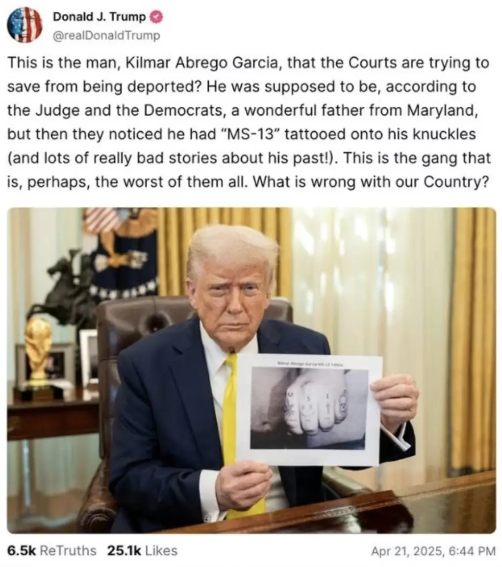 Trump holding up a photo of Garcia's hand, with 'MS-13' typed on each knuckle.Credit: Truth Social
