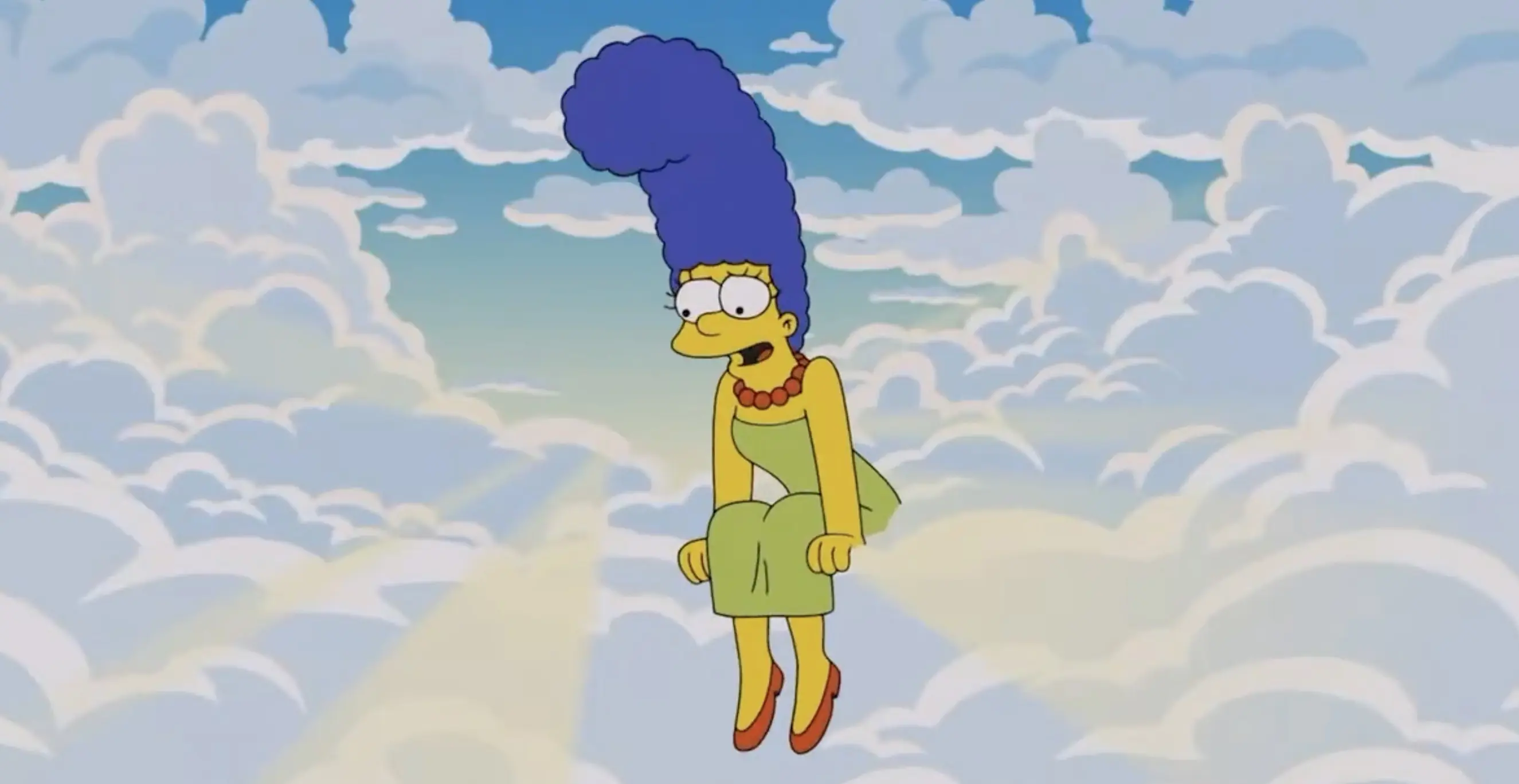 Marge looking down at her children from Heaven. Credit: The Simpsons/Fox/Disney+ (screenshot)