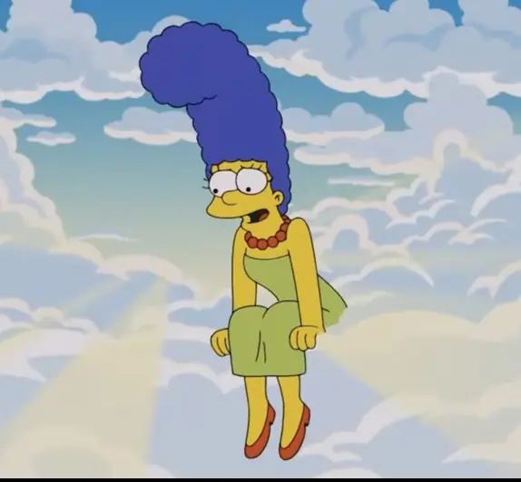 Marge looking down at her children from Heaven. Credit: The Simpsons/Fox/Disney+ (screenshot)