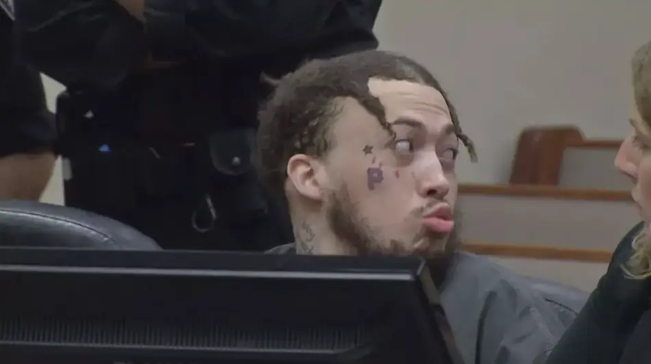Chilling clip shows 'despicable' moment man blows a kiss in court to mom of two teens he murdered