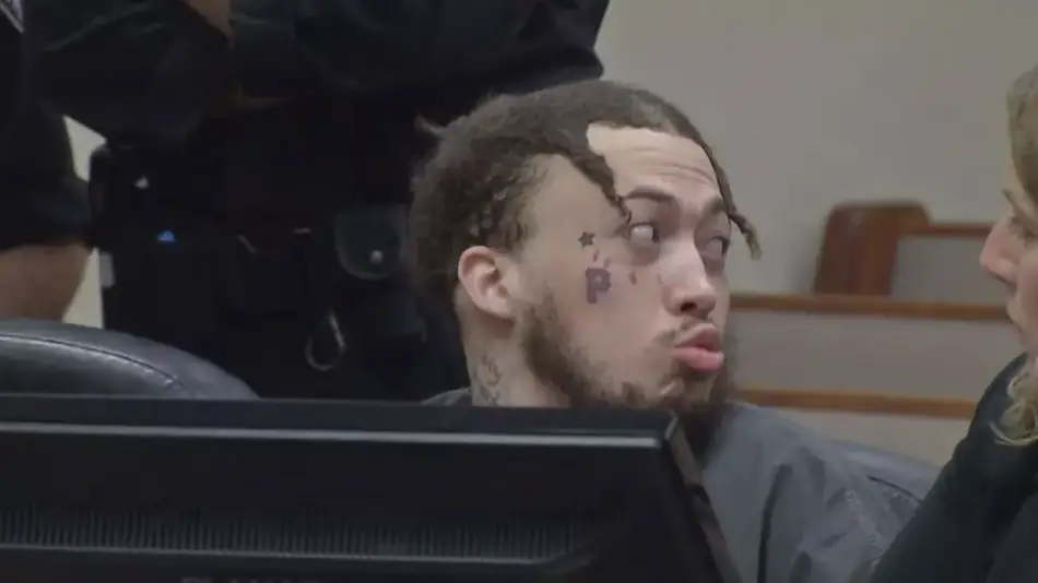 Chilling clip shows 'despicable' moment man blows a kiss in court to mom of two teens he murdered