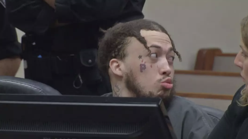 Chilling clip shows 'despicable' moment man blows a kiss in court to mom of two teens he murdered
