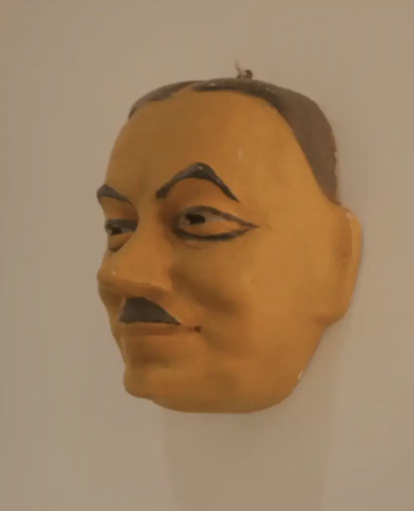 Dr. G was unsure whether this mask was supposed to resemble Adolph Hitler or Charlie Chaplin. Credit: Dr G. Explains / YouTube.