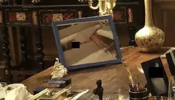 The image on the table appears to show a woman lying down. Credit: House Committee on Oversight and Government Reform