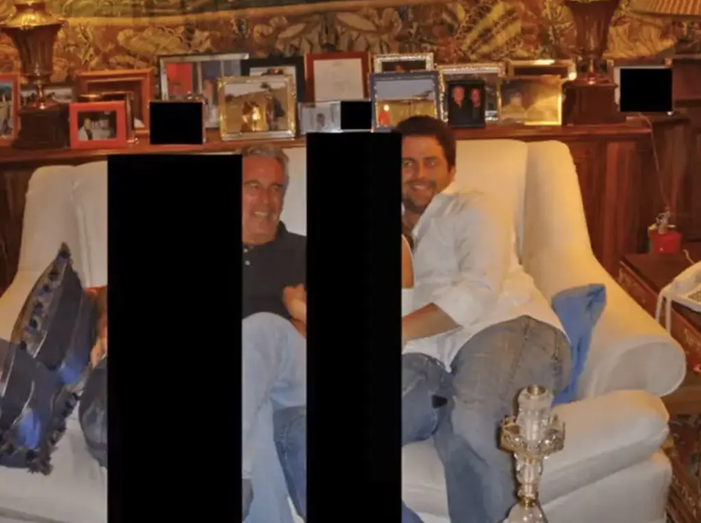 Ratner was photographed with Epstein and two redacted women. Credit: Department of Justice