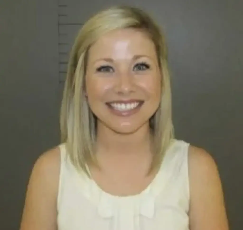 Fowlkes is seen smiling in her mugshot. Credit: Caldwell County Sheriff's Office