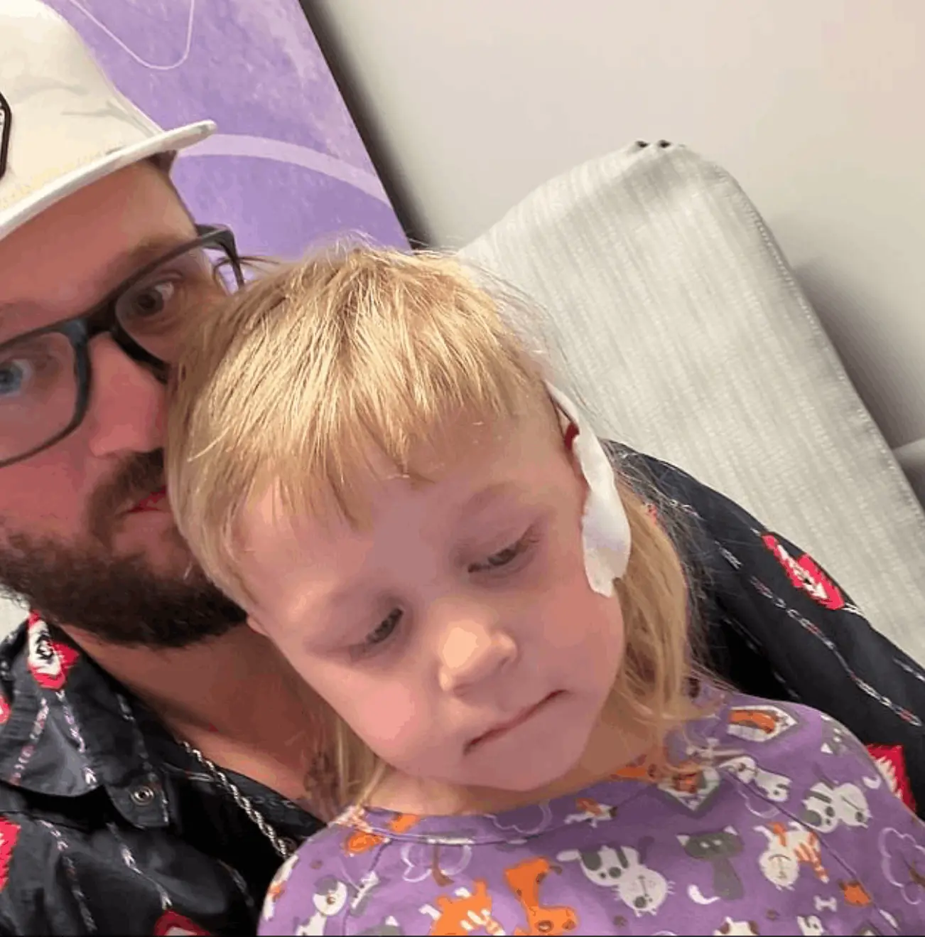 Cyler Hillman with his father following surgery. Credit: Hillman Family/GoFundMe