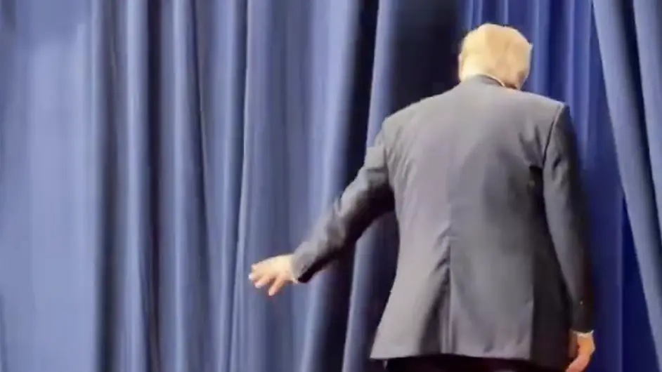 Trump was seen flicking his hand towards the staffers off-stage, who responded. Credit: X