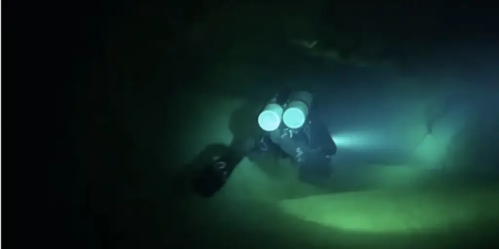 A diver navigates the complex Thinwana Kandu cave. Credit: youtube/Neva Divers