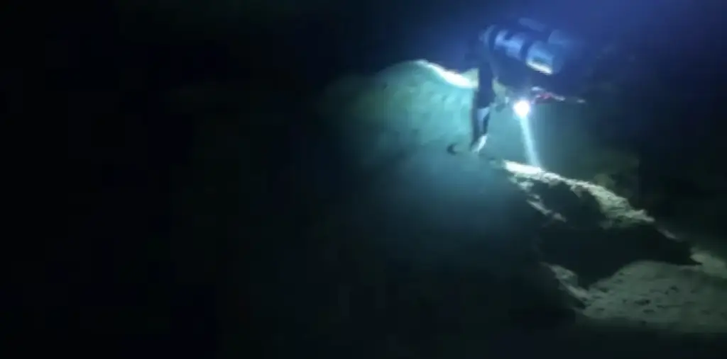 The cave is a series of dark narrow tunnels. Credit: Youtube / Neveda Divers