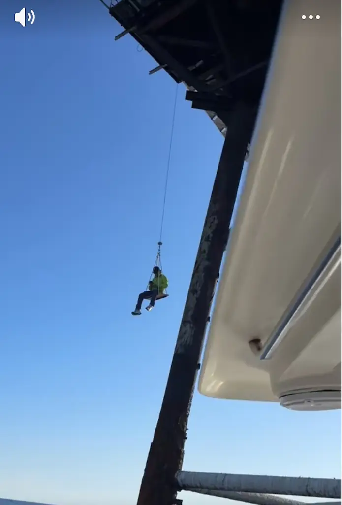 Guests have to be winched up to the tower over shark-infested waters. Credit: TikTok/CaptainAustinsFishing