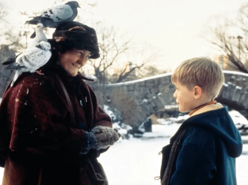 Kevin and the Pigeon Lady would become close friends in Home Alone 2. Credit: 20th Century Studios