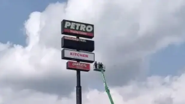 AJ Gow was left stranded in a petrol station sign