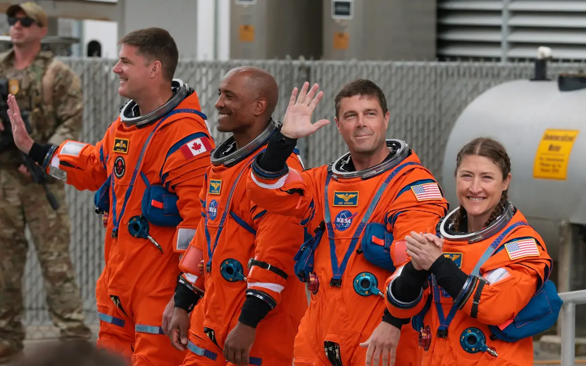 The astronauts were seen leaving in orange spacesuits. Credit: Getty Images